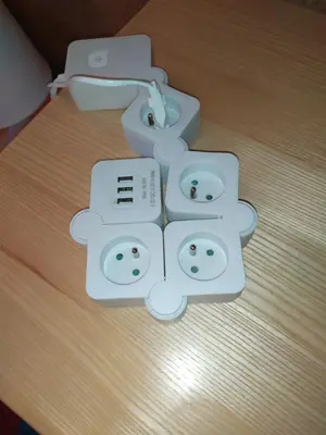 two nintendo wii game controllers sitting on a table at Origami Apartament in Kraków