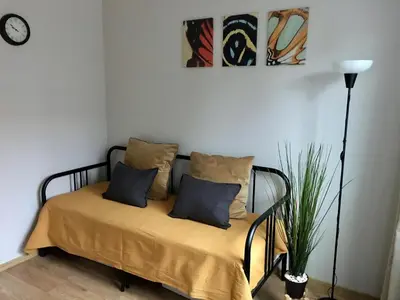 a bed with two pillows on it in a room at Apartament Łagiewniki 2 in Kraków