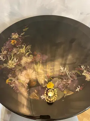 a bowl of water with a vase of flowers in it at Kazimierz Art Apartment for 2 in Kraków