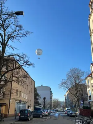 a frisbee flying in the sky over a street at Kazimierz Art Apartment for 2 in Kraków