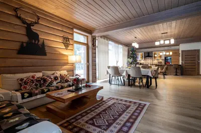 a living room with a couch and a table at Domek nad Potokiem 2 in Nowy Targ