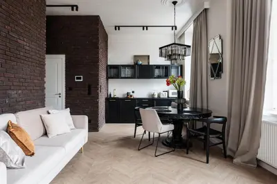 a living room with a white couch and a table at Luksusowy Apartament na Podgórzu - by Upstairs in Kraków