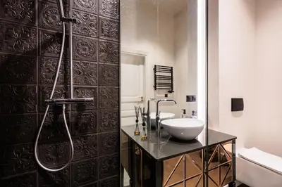 a bathroom with a sink and a shower at Luksusowy Apartament na Podgórzu - by Upstairs in Kraków