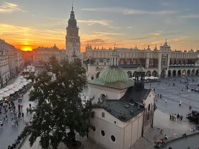a large building with a clock tower in a city at Queen's apartment from the 14th century - 130 m2 AC in Kraków