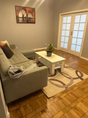 a living room with a couch and a coffee table at Queen's apartment from the 14th century - 130 m2 AC in Kraków