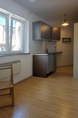 an empty room with a kitchen with a counter at Take a rest in the center of Krakow, Zyblikiewicza in Kraków