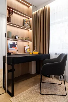 a black desk with a chair in a room at Househost Apartment Retoryka in Kraków