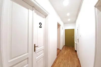a hallway with a door with the number on it at Old Town Apt - 5 bedrooms Sołtyka S2 in Kraków