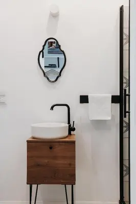 a bathroom with a sink and a mirror on the wall at Golden Merchant Main Square in Kraków