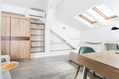a dining room with a table and chairs at LION apartments - Elegance in Kraków