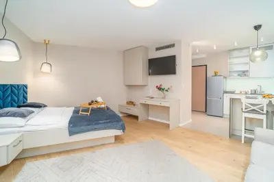 a kitchen and living room with a sliding glass door at Comfy Apartment Old Town - by Hosty in Kraków