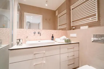 a kitchen with a table and a tv on the wall at Comfy Apartment Old Town - by Hosty in Kraków