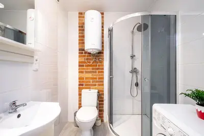 a bathroom with a shower and a toilet and a sink at RentPlanet - Studio Mazowiecka in Kraków