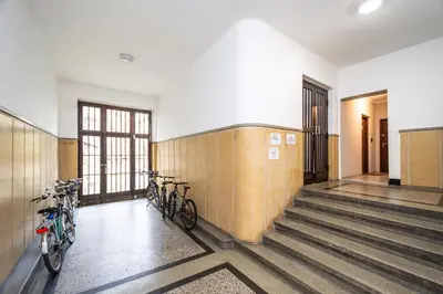 a hallway with two bikes parked in a building at RentPlanet - Studio Mazowiecka in Kraków