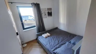 a small bedroom with a bed with two teddy bears on it at Stodoła pod Bacówką Zawoja Sauna Jacuzzi in Skawica