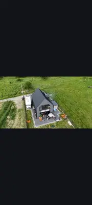 an aerial view of a large building in a field at Stodoła pod Bacówką Zawoja Sauna Jacuzzi in Skawica