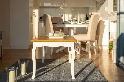 a table with a plate on it in a kitchen at Malila Premium Apartments Cracow Masarska 11 in Kraków