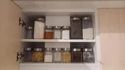 a pantry filled with lots of glass jars at Centrum Krakowa, apartament z ogrodem i parkingiem in Kraków
