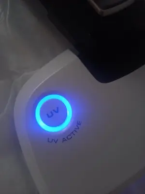 a close up of a computer mouse with a blue light at Centrum Krakowa, apartament z ogrodem i parkingiem in Kraków