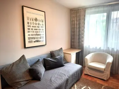 a kitchen with a sink and a stove top oven at Apartament Reja 11 in Kraków