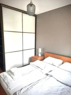 a living room with a couch and a television at Apartament Reja 11 in Kraków