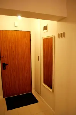 a room with a hallway leading to a living room at Apartament Reja 11 in Kraków