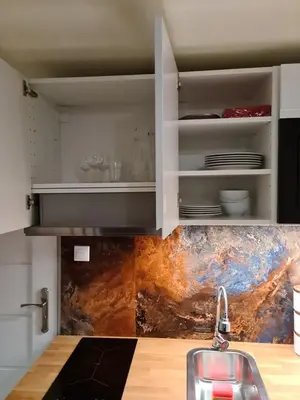 a kitchen with a sink and a counter top at Amber Hostel in Kraków