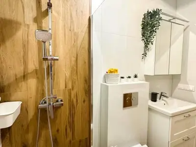 a bathroom with a shower and a toilet and a sink at Makowy Domek in Maków Podhalański