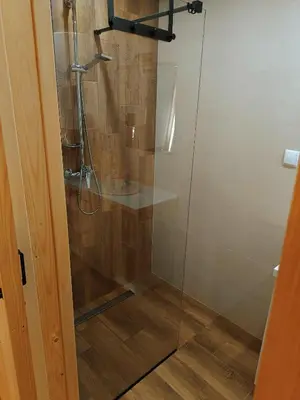 a shower stall with a glass shower door at Zawojska Kapryśnica Zawoja Górna 2970 in Zawoja