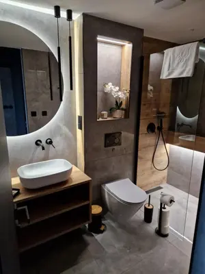 a bathroom with a sink and a toilet and a shower at CzarnyHetman in Grzechynia
