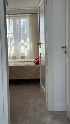 a bedroom with a bed and a window at Two Bedrooms City Center Krakow in Kraków