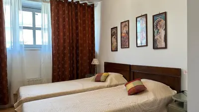 a bedroom with two beds and a window at Two Bedrooms City Center Krakow in Kraków