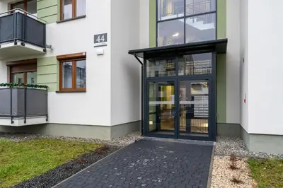 an entrance to a house with a black door at Apartments Deluxe Barcelona 55 by BookingHost in Kraków
