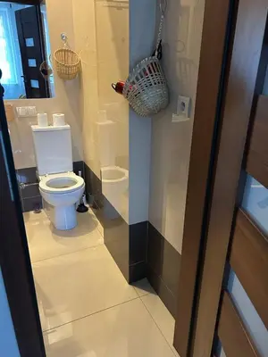 a bathroom with a toilet in a room at KR apartment in Kraków