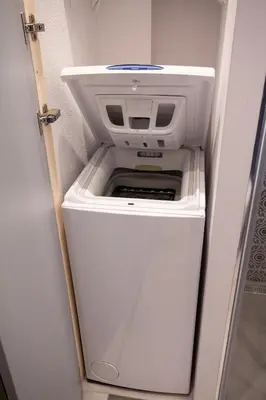 a small white refrigerator with its door open at Yesblisko in Kraków