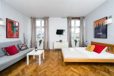 a living room with two beds and a couch at Horizon Apartments - Dom Sapiehy in Kraków