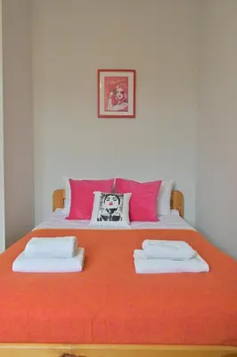 a bedroom with a bed with two towels on it at Horizon Apartments - Dom Sapiehy in Kraków
