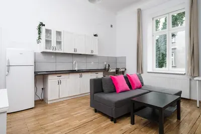 a living room with a couch and a table at Horizon Apartments - Dom Sapiehy in Kraków