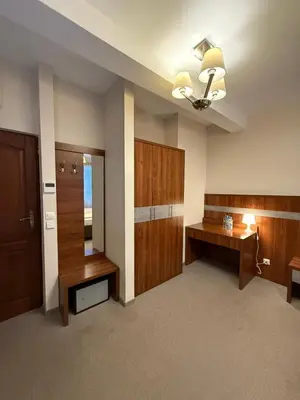 a large room with a vanity and a dressing room at Hotel Karpik Zator Graboszyce in Graboszyce