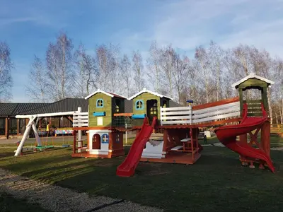a park with a playground with a slide and a swing at Hotel Karpik Zator Graboszyce in Graboszyce