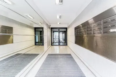 an empty street in front of a building at Skowronia Modern Apartment by BookingHost in Kraków