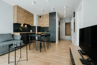 a living room with a couch and a table at Domus Aurea Free Parking Garden Balcony in Kraków
