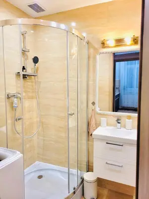 a bathroom with a shower and a sink at Castle Street in Kraków