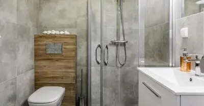 a bathroom with a shower and a toilet and a sink at Old Town Apt - Topolowa studio T33 in Kraków