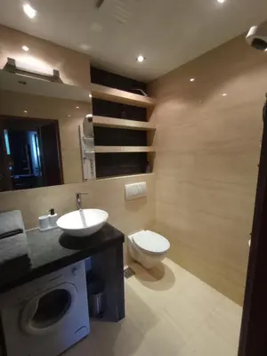 a bathroom with a sink and a toilet at Apartament Humberta in Kraków