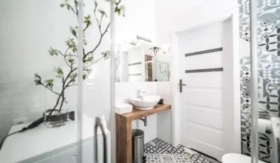 a white bathroom with a sink and a toilet at Old Town Apt - Wielopole studio W6 in Kraków
