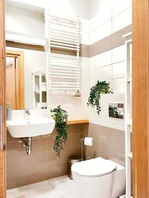 a bathroom with a toilet and a sink at Welcoming Apartments with bedrooms and Air Conditioning, city center in Kraków