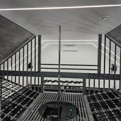 an empty auditorium with a pool in the middle at Secret Barn in Michalczowa
