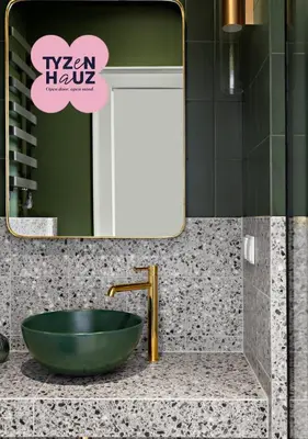 a bathroom with a green bowl sink and a mirror at Starowiślna Apartments by Tyzenhauz in Kraków