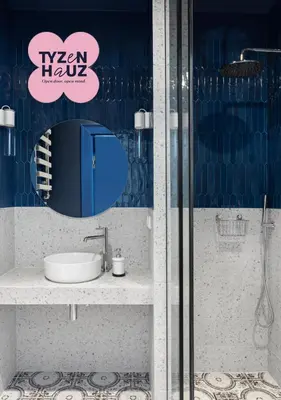 a bathroom with a sink and a mirror at Starowiślna Apartments by Tyzenhauz in Kraków